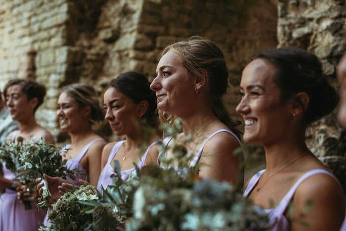 bride and bridesmaids smiling